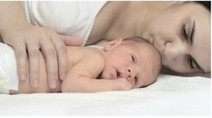 fourth timester mother laying down with baby